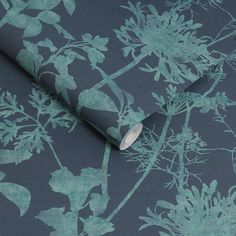 a blue and green wallpaper with flowers on it