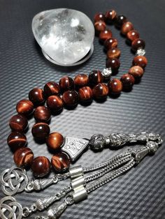 ✔️ This tasbeeh made from 10 mm natural red tiger eye beads. ✔️ AAA Grade Natural Stone Beads ✔️ Natural Color ✔️ Natural Stone Tesbih ✔️ Each order comes in a special box. ✔️ PLEASE CLICK THE LINK FOR ALL PRAYER BEADS MODELS https://www.etsy.com/shop/GoodJewelsofYazmasal Note: As a natural feature the stones beads may have some variations. 🌟🌟 SHIPPING 🌟🌟 United States (STANDART/DHL ECOMMERCE/USPS): 3-10 business days United States (EXPRESS/FEDEX): 1-3 business days Canada (STANDART/PTT Turk Polished Round Beads Rosary As Gift, Round Polished Bead Rosary As Gift, Polished Round Beads Rosary For Jewelry Making, 8mm Oval Beads For Gifts, 8mm Amber Spiritual Beads, 8mm Amber Beads For Spiritual Use, Gemstone Beads Rosary As Gift, Gift Polished Round Beads, 8mm Round Bead Rosary As Gift