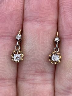 CLASSIC French Victorian diamond dormeuse (Sleeper) earrings with a secure 18k yellow gold lever back closure. There is an old cut approx. 2.2mm diamond in a prong setting on top .03ct. = .06ct. Not great quality The bottom diamonds cushion shaped old Mine Cut (thicker and small table)  cut 3.2x3.4 mm approx .21ct. each = .42ct. bottom diamonds clean white and sparkly Total estimated diamond weight .48ct. or just under 1/2ct.  The snap lever backs are stamped with French hallmarks and in good wo Vintage Yellow Gold Diamond Earrings With Rose Cut, Vintage Gold Diamond Earrings With Rose Cut, Vintage Gold Earrings With Rose Cut Diamonds, Vintage Yellow Gold Round Diamond Earrings, Victorian Gold Round Diamond Earrings, Gold Victorian Diamond Earrings, Antique Hallmarked Yellow Gold Diamond Earrings, Victorian Yellow Gold Earrings With Screw Back, Victorian Yellow Gold Diamond Earrings