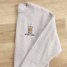 On the Rocks Iced Coffee Embroidered Crewneck Sweatshirt, Star, Frap Sweatshirt - Etsy Iced Coffee Embroidery, Women’s Sweatshirts, Crew Neck Sweatshirt Design, Embroidery Designs On Sweatshirts, Embroidered Shirt Designs, Tshirt Embroidery Ideas, Embroider Sweatshirts, Embroidery Designs Sweatshirt