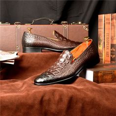 Step into a world of luxury and sophistication with our exquisite Luxury CrocTex Pointed Toe Slip-On Loafers. Crafted with the finest quality genuine leather, these loafers are designed to elevate your footwear game to new heights. With their elegant brogue shoe type, solid pattern type, and sleek pointed toe shape, these loafers are perfect for both formal and casual occasions. Experience maximum comfort and support with the soft and breathable cow leather lining and full grain leather insole. The rubber outsole provides excellent traction and durability, ensuring steady steps wherever you go. Elevate your footwear collection and make a statement with our Luxury CrocTex Pointed Toe Slip-On Loafers. Luxury Semi-formal Slip-on Moccasins, Luxury Brown Slip-on Moccasins, Luxury Slip-on Leather Shoes For Business, Office Dress Shoes With Brown Crocodile Pattern, Luxury Slip-on Tassel Loafers With Leather Lining, Brown Crocodile Pattern Dress Shoes For Office, Luxury Slip-on Dress Shoes With Textured Sole, Luxury Business Slip-ons With Almond Toe, Luxury Goodyear Welted Slip-on Loafers