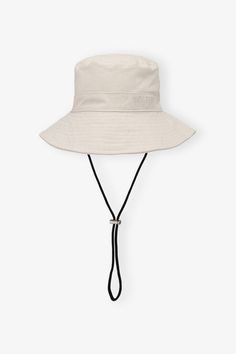 This Off-white Bucket Hat features a wide brim, an embroidered GANNI logo and a strap, that can be fastened with the adjustable clip. GANNI Off-white Bucket Hat | Women's Size Medium/Large Pink Knit Vest, White Bucket Hat, Bucket Hat Women, Pink Knit, Tshirt Skirt, Knit Vest, New Arrival Dress, Wide Brimmed, Bucket Hat