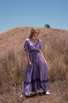 Introducing our captivating Lavender Maxi Dress, a glorious gypsy queen style that perfectly showcases our Into the Wild print and has been crafted from the softest high quality rayon. This dress is beautifully generous and sweeps into a stunning cascade, providing the ultimate swish. The Lavender Maxi Dress features a detailed bodice and buttons all the way through to double as a stunning duster. The softly gathered elastic waist ensures the perfect fit and you will love the handy pockets at th Lavender Maxi Dress, Wild Print, Queen Style, Lavender Floral, Floral Dresses Long, Into The Wild, Lilac Dress, Home Dress, Fabric Covered Button