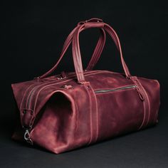 A travel bag is an element of the wardrobe of men and women who go on business trips, short-term vacations, short weekend trips. The Stout bag will store all your clothes and perfectly complement your look. This leather travel bag impresses with its appearance thanks to the natural material and metal fittings: Spacious and functional, roomy. With a large volume of 34 liters, you will find a place for everything you need to take with you: clothes, shoes, cosmetics, appliances, personal care produ Rectangular Leather Lined Duffle Bag For Overnight Trips, Rectangular Duffle Bag With Leather Lining For Overnight Trips, Rectangular Leather-lined Duffle Bag For Overnight Trips, Leather Lined Tote Bag For Overnight Trips, Large Capacity Burgundy Travel Bag, Red Duffle Bag With Luggage Sleeve For Weekend Trips, Rectangular Bags With Leather Lining For Overnight Trips, Soft Leather Rectangular Briefcase For Travel, Travel Briefcase In Soft Leather