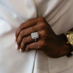 a close up of a person wearing a ring