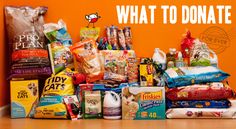 a pile of food sitting on top of a wooden floor next to an orange wall