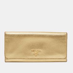 PRADA Gold Saffiano Lux Leather Logo Flap Continental WalletThis continental wallet from Prada is a must have fashionable accessory. With its classy exterior and practical shape this wallet functions as more than just a stylish carry on. It is made with beige Saffiano Lux leather and has a gold toned logo placed on the front. Keep your currency cards and other necessities safely in this wallet. Size: Height: 9 cm Width: 2 cm Length: 19 cmMaterial: Leather Handbag Wallet, Wallet Accessories, Leather Logo, Diaper Backpack, Casual Backpack, Luxury Women, Continental Wallet, Luxury Bags, Carry On