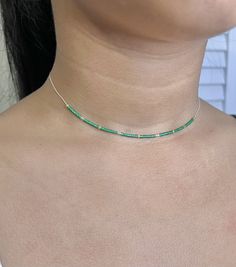 "This is a beautiful and delicate beads necklace. The vibrant emerald green for good fortune and positive energy.  It can be ordered in a different combination if you wish. Please message me for any special request.  It is on a Sterling Silver beading chain and can be layered with other jewelry.    Description: > Bead Style: Miyuki delica beads  > Finish: Sterling silver .925 > Length options : 13\", 14\", 15\", 16\", 17\", 18\" inch. Please contact me for any other size options.   A anti- tarni Green Emerald Beaded Necklace As Gift, Green Emerald Necklace With Adjustable Chain, Dainty Green Gemstone Beaded Necklaces, Elegant Green Beaded Necklace With Tiny Beads, Minimalist Green Emerald Necklaces, Dainty Green Adjustable Beaded Necklaces, Minimalist Green Round Bead Necklaces, Dainty Green Beaded Necklaces With Round Beads, Green Beaded Necklace For May Birthstone