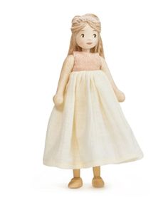 a doll in a white dress on a white background