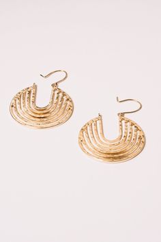 Reflecting a modern organic shape these beautiful gold hoop earrings are a fine investment in style. The hammered finish creates a unique texture that reflects the light and add a three-dimensional look. Materials: Alloy,18K Gold Plating Dimensions: Hangs 2", 1.5" wide Ships in a branded jewelry pouch and box, perfect for gift giving! Modern Organic, Organic Modern, Gold Hoop, Organic Shapes, Gold Hoop Earrings, Jewelry Pouch, Gold Plating, Handcrafted Jewelry, Three Dimensional