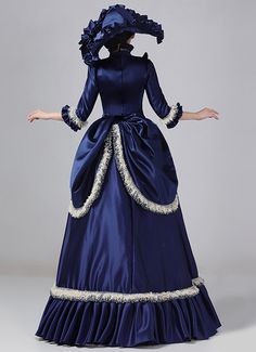 19th Century Navy Blue and Champagne Victorian Bustle Dress for Women Color:Navy Blue and Champagne   Material: This dress made of High Quality Satin, soft,smooth and comfortable to wear  Sleeve Length:  Long Sleeve  Dresses Length:Floor Length  Neckline:  Stand Collar  Decoration: Ruffles + Lace  Package Includes:  Dress + Hat   The length of skirt about 45 inches (114 cm) long from waist to hem regardless of size. This dress is pictured with a 6-hoop skirt Petticoat underneath to achieve Edwardian Ball Gown, Navy Blue And Champagne, Dresses Historical, Victorian Bustle Dress, Ball Gown Plus Size, Victorian Style Wedding Dress, Antique Wedding Dresses, Gothic Victorian Dresses, Victorian Bustle