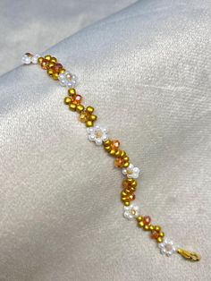 Autumn floral beaded bracelet Spring Gold Beaded Bracelets With Colorful Beads, Spring Gold Bracelets With Round Beads, Gold Round Beads Bracelets For Spring, Gold Bracelets With Round Beads For Spring, Gold Round Beads Bracelet For Spring, Elegant Flower Crystal Bracelet For Spring, Elegant Flower Shaped Crystal Bracelet For Spring, Spring Beaded Pearl Bracelet With Round Beads, Spring Beaded Pearl Bracelet