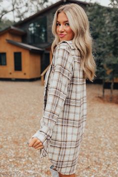 - Plaid season has officially arrived with this cozy dress! - Soft unlined material with a cream, brown, and serenity hued plaid print - A collared neckline - A button-up front - Long, loose sleeves with button closure cuffs - Hidden side pockets - A relaxed silhouette that ends in a mini dress length hemline Plaid Tunic Dress, Cozy Dress, Plaid Tunic, Fall Plaid, Loose Sleeves, Country Girl, Country Outfits, Plaid Print, Women Clothing Boutique