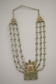 "This is a wonderful old unique One of a Kind Vintage Triple Strand Etched Red and Green Glass Pendant Necklace from the Himahal Prasesh region of Northern India. This silver triple strand necklace is unique in design and embellished with small pendants that hand from triangle pendants. The necklace could have been worn for festivals or used in ceremonies. designs Ornaments were not only worn for adornment and for their intrinsic value but also for certain religious and superstitious reasons. So Ornate Red Jewelry For Festivals, Red Vintage Necklace For Celebration, Vintage Red Necklace For Celebration, Traditional Double Strand Necklace As A Gift, Traditional Multi-strand Beaded Necklaces For Celebration, Traditional Multi-strand Festive Jewelry, Traditional Multi-strand Festival Jewelry, Traditional Multi-strand Jewelry For Festivals, Traditional Double Strand Beaded Necklaces For Gifts