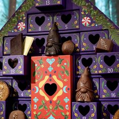 an assortment of chocolates are arranged in the shape of a house