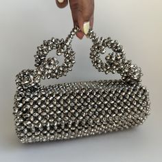 The Georgia Silver Bag is not just an accessory; it’s a statement piece that promises to elevate your style and add a touch of sophistication to any outfit. Whether you’re attending a formal event or a casual gathering, this bag is versatile enough to complement any occasion. Elegant Evening Box Bag With Chain Strap, Elegant Box Bag With Chain Strap For Events, Designer Evening Clutch With Top Carry Handle, Chic Silver Box Bag With Chain Strap, Elegant Bags With Chain Strap For Night Out, Elegant Bag With Chain Strap For Night Out, Formal Clutch Shoulder Bag, Elegant Shoulder Bag With Chain Strap For Events, Elegant Shoulder Bag With Chain Strap For Party