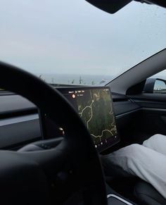 the dashboard of a car with an image of a map on it's screen