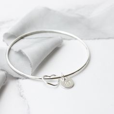 Sterling Silver Initials Bracelet, Minimalist Silver Heart Bracelet For Anniversary, Silver Sterling Name Bracelet With Heart Charm, Personalized Silver Sterling Bangle, Personalized Sterling Silver Bangle, Personalized Silver Round Bangle, Personalized Sterling Silver Bracelet For Anniversary, Personalized Sterling Silver Round Bracelet For Anniversary, Sterling Silver Name Bracelet With Heart Charm For Anniversary