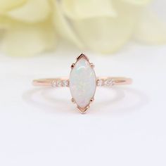 > Metal: 14K Solid white, yellow, and rose gold (18K available please contact us)> Center Stone : 10x5 mm Natural Opal> Center Stone shape: Marquise Shaped> Center Stone Weight: Approx 0.8ct> Number of Stones: 6 Round Diamonds (0.05ct)> Diamond Clarity: VS/SI1> Diamond Color: G> Band Width: 1.5mmMade to Order, All Handmade in the United States.◈◈ Since we use natural opal, each stone can have different colors in each stone ◈◈ Fine Jewelry In 14k Rose Gold, White Color, White 14k Rose Gold Ring For Gift, White 14k Rose Gold Rings Fine Jewelry, White 14k Rose Gold Rings As Gift, 14k Rose Gold White Rings Fine Jewelry, 14k Rose Gold White Rings As Gift, 14k Rose Gold Fine Jewelry Rings In White, White 14k Rose Gold Round Rings, White 14k Rose Gold Rings