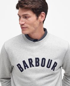 Inspired by classic sportswear, the Barbour Addington Sweatshirt is the perfect way to add a vintage touch to your daily layers. Complete with a varsity-inspired logo to the chest, this piece is the perfect accomplice to jeans and trainers for a day exploring nature. College Sweatshirt With Logo For Fall, College Logo Detail Sweatshirt For Fall, College Logo Sweatshirt For Fall, Classic Cotton Sweatshirt With Logo, Classic Crew Neck Sweatshirt With Logo Print, Classic Fall Sweatshirt With Logo Detail, Collegiate Crew Neck Tops With Logo Detail, Collegiate Crew Neck Sweatshirt With Logo Detail, College Crew Neck Sweatshirt With Logo Detail