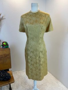 1950s Lame Dress / 50's Party Dress / Old Hollywood Lame Dress / 1950s dress / 50s dress / 1950s fashion / 1950s style  This vintage gold beauty was made to shimmer when you move. She is gold  with gold lame threads throughout. She shines, glints, and mesmerizes like an Old Hollywood Starlet Dress should. This dress is absolutely light catching and stunning in a very classy way. She has back metal zipper and is fully lined. She is not only sassy looking but she is actually quite comfortable. Measurements provided are flat and have been doubled. Bust 42" Waist 34" Hips 43"   Length 39.5" ❤️ Condition: Excellent vintage condition. Flaw: on the back right shoulder blade there is a small black mark. please see photo. This item has been cleaned and is ready to wear. $148 includes domestic shipp Fashion 1950s Style, 1950s Style, Lame Dress, Gold Lame, Gold Beauty, Fashion 1950s, 1950s Dress, 50s Dresses, 1950s Fashion