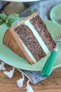 a slice of chocolate cake on a green plate