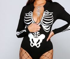 Create a stylish spooktacular look this Halloween season with this sultry bodysuit! It features a mock neckline. a zip front to create a V-neckline. long sleeves. a cheeky bottom with a dual snap button closure. and a front skeleton print. Complete your costume with chic fishnet tights and face gems for a glam vibe.Fit & Features Mock neckline Zip front Long fitted sleeves Cheeky bottom. dual snap button closure Front skeleton print Knit fabric. moderate stretch Runs true to size Halloween Costu Gothic Bodysuit For Halloween Costume Party, Stretch Long Sleeve Bodysuit For Costume Party, Edgy Long Sleeve Bodysuit For Night Out, Halloween Long Sleeve Bodysuit For Costume Party, Halloween Long Sleeve Costume Party Bodysuit, Long Sleeve Bodysuit For Halloween Costume Party, Fitted Long Sleeve Bodysuit For Halloween, Gothic Black Bodysuit For Halloween, Black Gothic Bodysuit For Halloween