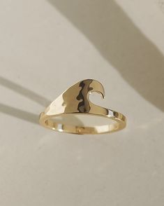 Material: 10k gold plated over brass Dimensions: 9mm (ring face) Coastal Fits, Ocean Rings, 9mm Ring, Gold Thumb Rings, Unique Gold Rings, Gold Wave Ring, Summer Rings, Preppy Jewelry, Jewelry Lookbook