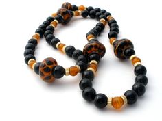 Vintage Beaded Jewelry - This is a stylish black onyx bead necklace with amber art glass and gold plated spacers. It is 28" long, gemstones are .38" (10mm) and the art glass beads are slightly over .75 (29mm), weighs 111 grams. Onyx Bead, Bead Necklace, Black Onyx, Art Glass, Mens Bracelet, Onyx, Beaded Jewelry, Glass Art, Glass Beads