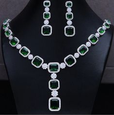 Handmade Necklace with Earrings American diamond and Emerald Necklace set with earings. This beautifully handcrafted necklace is set in sterling silver 925. Pose your festive best with this necklace..  It will go with everything and make your outfit super chic. Diamond -- American  Diamonds  Diamond Wt --22.39ct approx Diamond Shape -- Round Gemstone-- Emerald (Lab created)  Metal -- Sterling Silver  Silver Wt.  -- 35.800gm Silver Purity--92.5%  Necklace Finish Antique gold                   Nec Formal Jewelry Sets With Cubic Zirconia Jewels, Dazzling Formal Jewelry Sets With Jewels, Dazzling Cubic Zirconia Emerald Necklace For Formal Occasions, Fine Jewelry Sets With Jewels For Anniversary, Dazzling Hand Set Jewelry Sets For Gift, Dazzling Hand Set Jewelry Sets As Gifts, Dazzling Hand-set Jewelry Sets For Gifts, Dazzling Sterling Silver Jewelry Sets With Elegant Design, Hand Set Emerald Necklace With Cubic Zirconia For Party