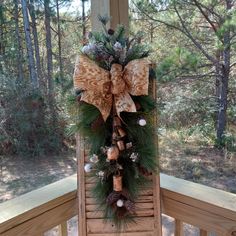 a christmas wreath on top of a wooden step