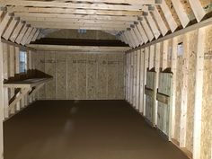 the inside of a building that is being built with wooden walls and floor joists