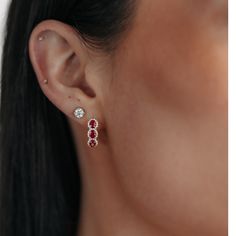 Our gemstone earrings are impeccably crafted. Set in 18K white or yellow gold, they feature regal red oval-cut Rubies intricately encompassed by a halo of round brilliant-cut Diamonds. Add an extravagant yet subtle splash of color to any ensemble! This piece really pops when paired with other rubies from our Gemstone Collection. Natural Rubies: 1.30ctw Natural Diamonds: 0.20ctw 18K White or Yellow Gold Length: 1.5 Inches Diamond Halo Earrings, Halo Diamond Earrings, Gemstone Collection, Halo Earrings, Ruby Diamond, Natural Ruby, Diamond Halo, Round Brilliant Cut Diamond, Eternity Bands