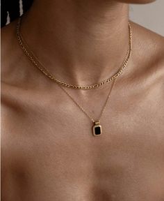 Our gold chain necklace is not just any ordinary piece of jewelry. It is a statement piece that will instantly upgrade your fashion game. The exquisite design features a sleek black onyx stone, adding a touch of sophistication and class to any outfit.   Crafted from sturdy stainless steel, this necklace is built to last. The multi-layered design adds depth and dimension, creating a visually stunning piece that is sure to catch the eye. The gold chain adds a touch of luxury, while the black onyx stone adds a modern and edgy twist.   Whether you're dressing up for a special occasion or simply want to add a touch of elegance to your everyday look, this necklace is the perfect accessory. It effortlessly elevates any ensemble, making it a must-have for those with a keen sense of style. Waterproof Necklace, Jewellery Photography Inspiration, Black Onyx Necklace, Luxe Jewelry, Double Strand Necklace, Gold Statement Necklace, Onyx Necklace, Square Pendant, Gold Necklace Layered