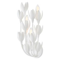 a white flower lamp with three lights on each side and one light on the other