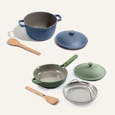 various pots and pans on a white surface