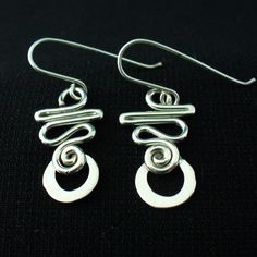 These earrings are hand crafted in solid sterling silver.I use 16 gauge wire for these so they're nice and light but not flimsy.For a unique,long lasting and clearly handmade pair of everyday dangles that won't break the bank.These will do the trick. Handmade Silver Drop Wrap Earrings, Unique Silver Plated Wire Earrings With Ear Wire, Unique Silver Plated Wire Earrings, Hypoallergenic Silver Wrap Earrings In Sterling Silver, Hypoallergenic Silver Sterling Silver Wrap Earrings, Hypoallergenic Sterling Silver Wrap Earrings, Unique Sterling Silver Pierced Wrap Earrings, Unique Sterling Silver Wrap Earrings, Silver Hypoallergenic Dangle Wrap Earrings