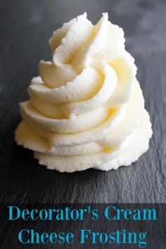 a stack of cream cheese frosting sitting on top of a black counter next to the words decorator's cream cheese frosting