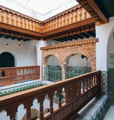 the inside of a large building with wooden balconies and tilework on the walls