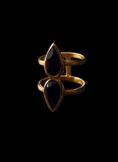 This double pear onyx ring is made with 14kg gold plating that has 3 microns of gold, adding a touch of elegance and class to any outfit. With its unique design and high-quality materials, this ring is the perfect accessory for any occasion. Make a statement with this unique and eye-catching ring, perfect for any occasion. Elevate your style with this must-have accessory. Available in size 5-10. Black Onyx Stone, Onyx Ring, Onyx Stone, Black Onyx, Gold Plating, Onyx, Sterling Silver Rings, Pear, Unique Design