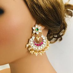 Beautiful and Unique Style Affordable Luxury traditional Bollywood Chandbali earrings with Kundan stones and Colored ruby semi precious Stones. 22k gold plated jewelry Length: 2.25 Inches Click here to see the complete collection of Kundan and Polki Statement Earrings at AryaFashions: https://www.etsy.com/shop/AryaFashions?section_id=25872820 Follow us on social media for new and latest designs: Facebook: www.facebook.com/shoparyafashions Pinterest: www.pinterest.com/aryafashions Instagram: www. White Bridal Earrings For Reception And Festivals, Heavy White Bridal Earrings For Reception, Heavy White Chandbalis For Reception, Festive White Cutdana Bridal Earrings, White Kundan Chandelier Earrings For Wedding, Chandbali White Bridal Earrings For Celebration, Celebration Chandbali White Bridal Earrings, White Temple Jewelry Jhumkas For Reception, Celebration White Chandbali Bridal Earrings