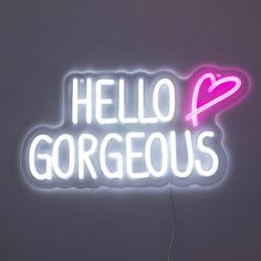 a neon sign that says hello gorgeous