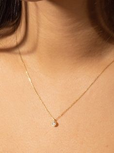 "This solitaire diamond necklace is made of 14k Solid Yellow Gold and round cut solitaire zircon stone. A dainty minimalist gold jewelry and cool piece combining perfect with daily outfits and a perfect gift for her :)  We can produce it in 14k Solid Yellow Gold, 14k White Gold or in 14k Solid Rose Gold, please choose from options list.  The \"Single Diamond Necklace\" has a round cut zircon pendant. We can produce it with real diamond as special order. Please contact with us via Etsy Message fo Minimalist Diamond Birthstone Necklace With Bezel Setting, Minimalist Cubic Zirconia Necklace With Bezel Setting, Everyday Minimalist Solitaire Necklace With Bezel Setting, Minimalist Diamond White Solitaire Necklace With Bezel Setting, Minimalist Diamond Solitaire Necklace With Birthstone, Dainty Diamond Necklace With Bezel Setting, Dainty Round Cut Diamond Necklace For Everyday, Everyday Dainty Round Cut Diamond Necklace, Minimalist Diamond Birthstone Necklace