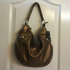 ***Mossimo***Small Bronze Hobo Handbag With Zip Closure. Has An Interior Zipper Compartment And 2 Wall Pocket. New With Tags. Bag Is In Mint Condition. No Trades. Hobo Shoulder Bag With Gold-tone Hardware For Shopping, Shopping Hobo Shoulder Bag With Metal Hardware, Orange Shoulder Bag With Gold-tone Hardware, Gold Hobo Shoulder Bag With Metal Hardware, Hobo Tote Bag With Metal Hardware For Errands, Double Handle Hobo Bag With Metal Hardware, Orange Satchel With Gold-tone Hardware For Shopping, Orange Tote Shoulder Bag With Gold-tone Hardware, Gold Hobo Bag With Metal Hardware For Daily Use