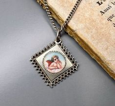 A beautiful genuine vintage Guardian angel medal, petite enamel 800 silver, German religious lucky charm, fairly rare Guardian angel charm, hallmarked, in good vintage condition. Ideal for protection necklace, would make a nice gift for someone special! Comes with 18-inch long vintage 925 silver necklace (see photo 3)! Material: solid silver  Total weight: 6.1g Measures: approx. 23 x 23 mm (0.9 x 0.9 inch)  PLEASE LOOK AT THE PICTURES, THEY ARE PART OF THE DESCRIPTION AND ARE THE ACTUAL ITEM YOU WILL RECEIVE. ALL OUR ITEMS ARE IN WORN, VINTAGE CONDITION. Vintage Charm Necklaces For Gifts, Vintage Charms Necklace For Gift, Vintage Silver Necklace With Miraculous Medal, Antique Silver Medallion With Miraculous Medal, Vintage Silver Locket Charm Necklace, Vintage Silver Charm Necklace With Locket, Vintage Silver Locket Charm Necklaces, Antique Engraved Charm Necklaces For Gift, Silver Medallion Charm Necklaces With Vintage Charm