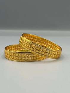 Our 24k Polished Bangles are more than just accessories; they are symbols of grace and beauty, inspired by the rich heritage of Indian, Pakistani, and Nepali jewelry. These stunning bangles showcase the timeless elegance of traditional craftsmanship, perfectly complementing your attire for weddings, festivals, or any special occasion Our company offers expedited Next-Day Delivery Services within the United Kingdom, ensuring prompt and efficient transportation of goods.  Additionally, we strive to extend our shipping capabilities to cater to customers worldwide, aiming to provide the fastest possible shipping methods to international destinations. To ensure the highest standards of hygiene, we kindly request your understanding that all sales are final, and we are unable to accept returns or Gold Temple Jewelry With Hallmark, Gold Hallmarked Temple Jewelry, Traditional Yellow Jewelry With Intricate Design, Gold Plated Yellow Jewelry With Intricate Design, Traditional Yellow Jewelry For Formal Occasions, Yellow Gold-plated Jewelry With Intricate Design, Traditional Yellow Formal Jewelry, Traditional Yellow Gold Filigree Bracelets, Traditional Filigree Bangle For Festive Occasions