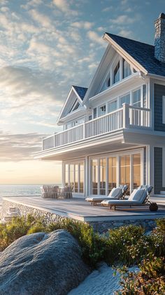 an artist's rendering of a house on the beach with chaise lounges