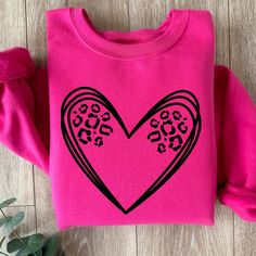 Leopard heart tee or crewneck is such a cute and simple design to make a big impact. Choose any color to make it pop.  Size up one for a baggier oversized fit. These shirts are made to order so you get exactly what you want. Join our fb group for specials: https://www.facebook.com/groups/708500593017136/?ref=share Oversized Heart Graphic T-shirt With Crew Neck, Oversized Heart Graphic Crew Neck T-shirt, Oversized Crew Neck T-shirt With Heart Graphic, Oversized Heart Graphic T-shirt For Streetwear, Trendy T-shirt With Heart Graphic For Everyday, Long Sleeve T-shirt With Heart Graphic For Streetwear, Casual Crew Neck T-shirt With Heart Patch, Pink Heart Graphic T-shirt For Streetwear, Oversized Heart Print Casual Tops