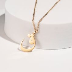 This stunning necklace features a beautifully crafted pendant with a personalized Arabic letter. The elegant design of the letter captures its unique and intricate beauty, making it a focal point of sophistication and charm. The pendant hangs from a delicate chain, perfect for adding a touch of elegance to any outfit. Ideal for everyday wear or special occasions, this necklace makes a meaningful and stylish statement. It also serves as a thoughtful and personalized gift for loved ones, celebrati Elegant Metal Initial Pendant Necklace, Gold Metal Pendant Initial Necklace, Gold Metal Initial Pendant Necklace, Elegant Cross Pendant Necklace As Gift, Engraved Initial Pendant Chain Necklace As Gift, Elegant Cross Pendant Necklace For Gift, Engraved Initial Pendant Chain Necklace For Gifts, Elegant Personalized Metal Chain Necklace, Elegant Name Necklace With Adjustable Chain