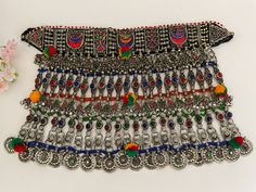 Afghan necklace, Afghan vintage choker, Afghan jewelry. It is all handmade and is made with multicolor gems and beads.  It is for all kinds of cultural occasions. Some designs may differ due to the handwork and vintageness of the item. Handmade Round Beads Choker For Festivals, Multicolor Traditional Pattern Necklace As Gift, Handmade Choker With Round Beads For Festivals, Traditional Multicolor Necklace With Traditional Patterns, Traditional Handmade Round Bead Choker, Traditional Handmade Round Beads Choker, Bohemian Necklaces With Traditional Patterns For Festivals, Traditional Handmade Choker With Round Beads, Traditional Beaded Necklaces For Festival Gift